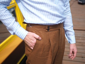high waist linen trousers for men, bespoke details,side adjusters, double pleated front and wide two button waistband