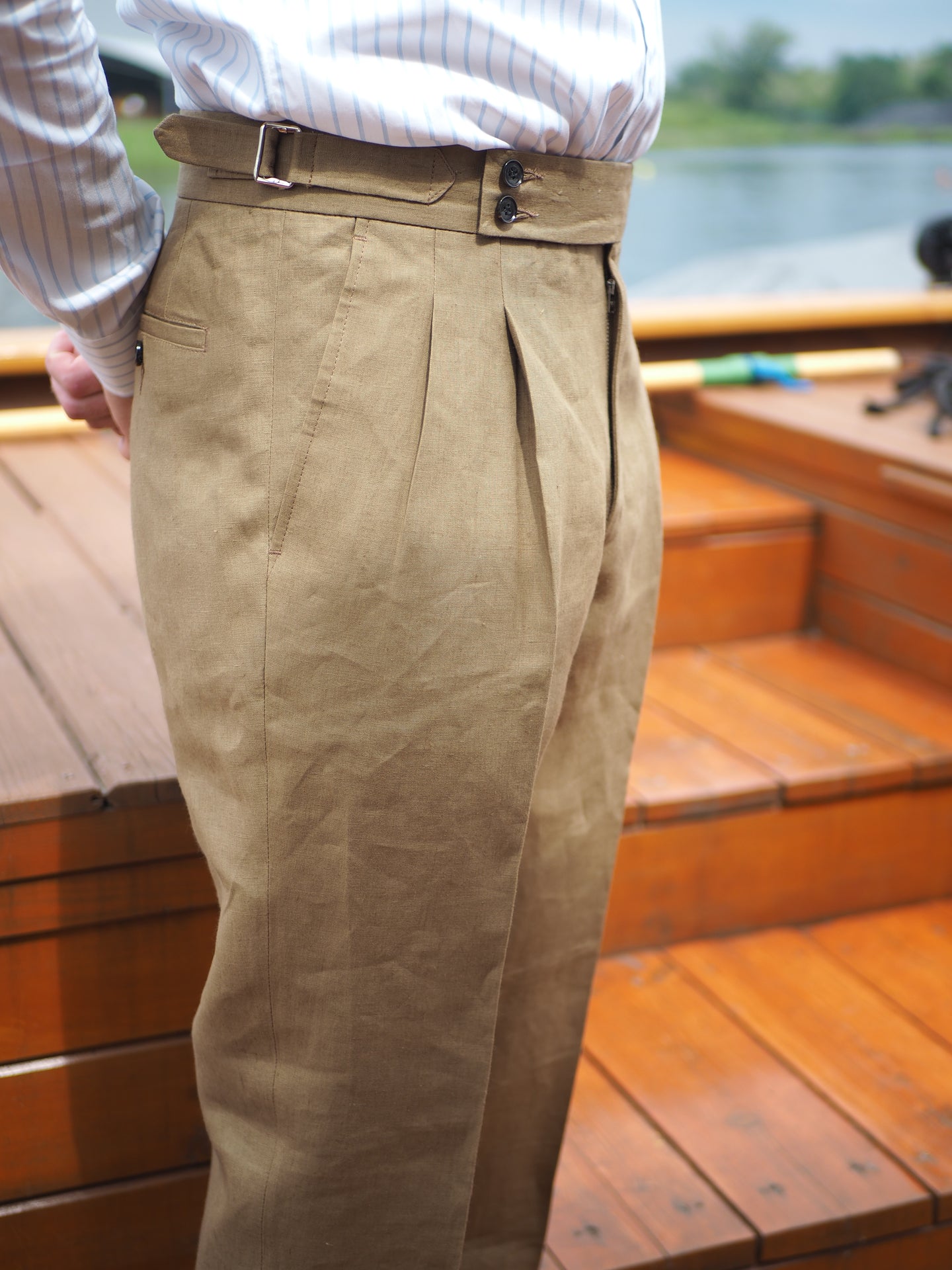 Taupe Sartorial trousers collection represent tailored craftmanship to a trouser with side adjusters and side tabs and its extended waistband.