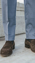 Load image into Gallery viewer, Close-up of blue melange wool  pants with a 5 cm turn up and brown suede loafers on a concrete surface