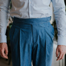 Load image into Gallery viewer, Gurkha pants cut from blue denim with high waist and side adjusters